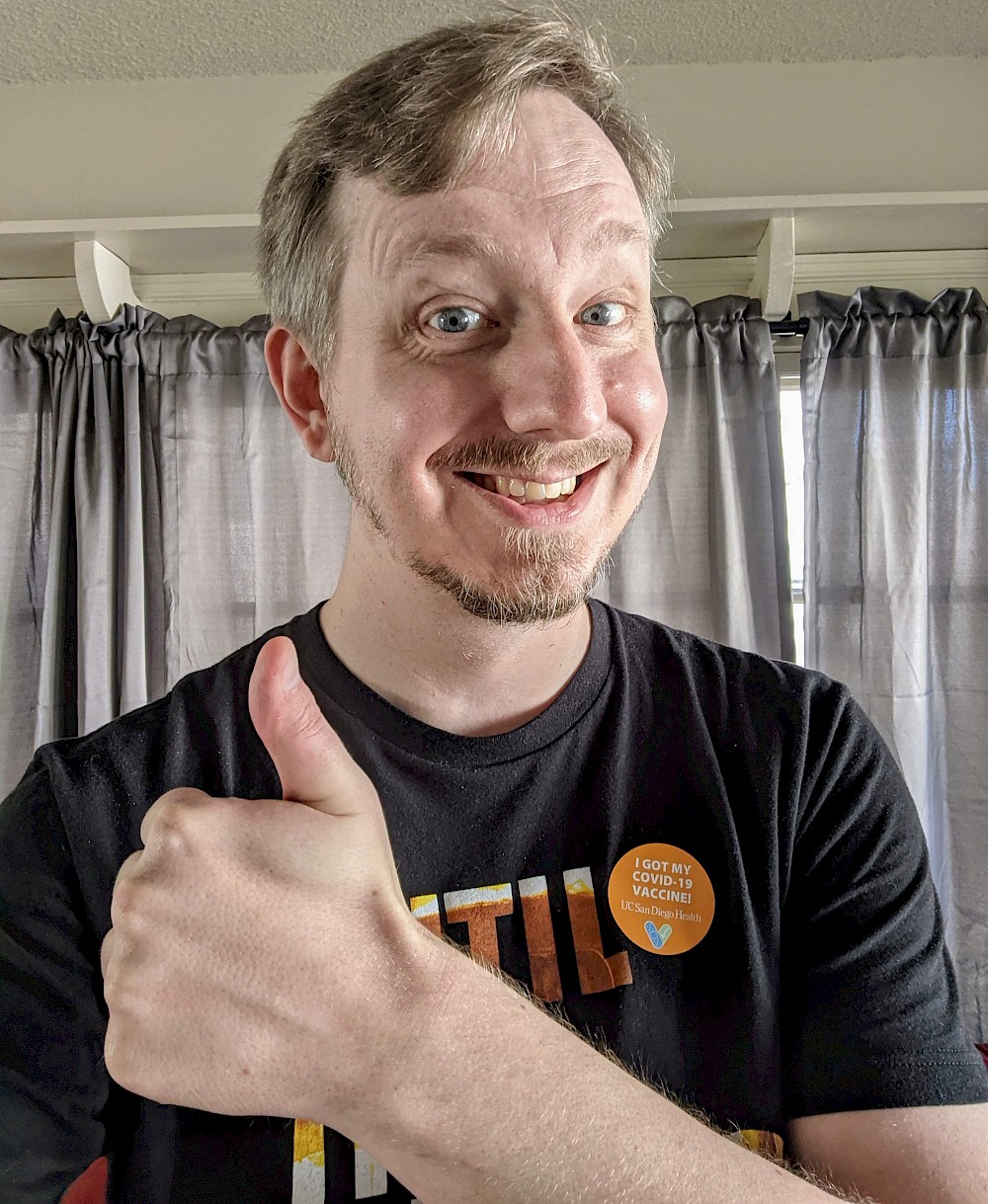 myself giving a thumbs up with a big smile and a i got my covid